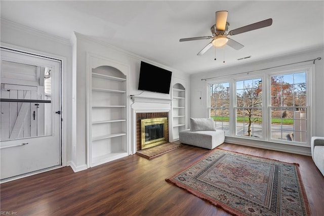104 Camden Way Unit G, Yorktown, VA 23693 - living room featuring wood finished floors, a brick fireplace, built in shelves, ornamental molding, and ceiling fan