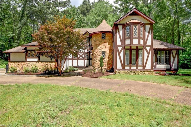 324 Woodards Ford Rd, Chesapeake, VA 23322 - tudor home with stone siding and a front lawn