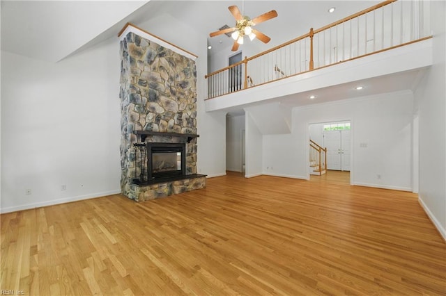 133 Mid Ocean, Williamsburg, VA 23188 - unfurnished living room featuring stairs, high vaulted ceiling, wood finished floors, a ceiling fan, and baseboards