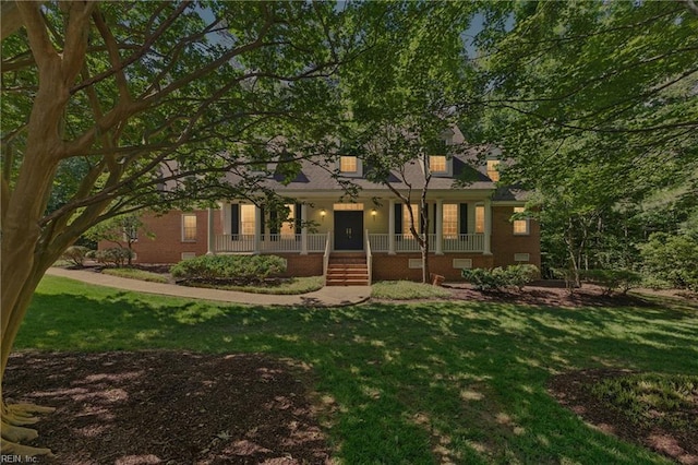 133 Mid Ocean, Williamsburg, VA 23188 - view of property hidden behind natural elements with a porch, a front yard, and brick siding