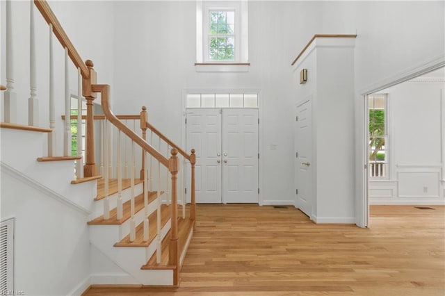 133 Mid Ocean, Williamsburg, VA 23188 - foyer entrance with a high ceiling, light wood-style flooring, baseboards, and stairs