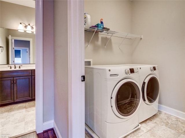 88 Alexandria Way, Carrollton, VA 23314 - laundry room with washer and dryer, a sink, and baseboards