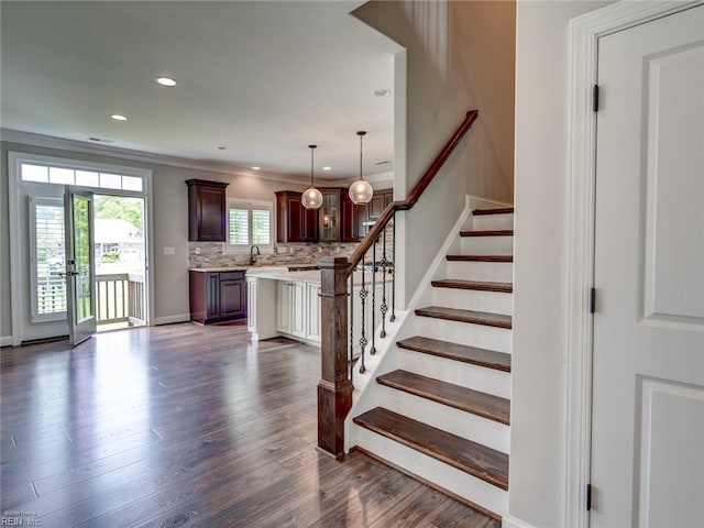 88 Alexandria Way, Carrollton, VA 23314 - staircase featuring wood finished floors, ornamental molding, recessed lighting, and baseboards