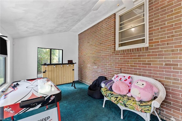 603 Page Dr, Hampton, VA 23669 - rec room featuring carpet floors, brick wall, and lofted ceiling