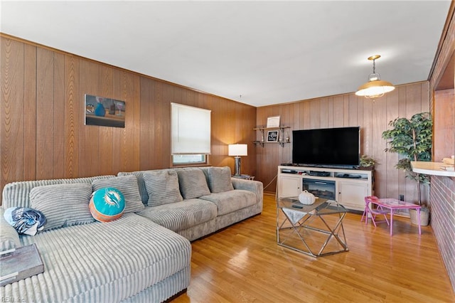603 Page Dr, Hampton, VA 23669 - living area featuring light wood-type flooring and wooden walls