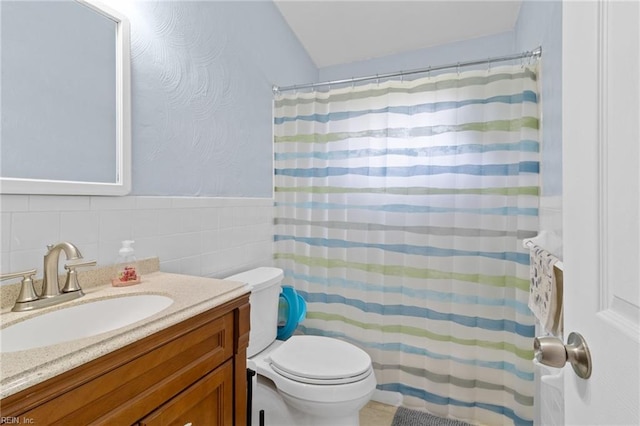 441 Cummings Rd, Virginia Beach, VA 23452 - full bathroom featuring vanity, toilet, tile walls, curtained shower, and lofted ceiling