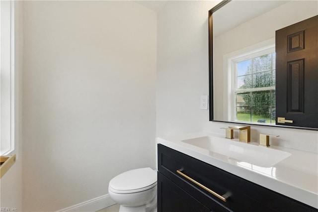 8457 Radnor Rd, Norfolk, VA 23503 - half bath with vanity, toilet, and baseboards