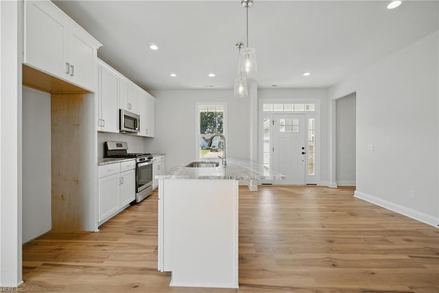 225 Ayrshire Loop, Smithfield, VA 23430 - kitchen with appliances with stainless steel finishes, a sink, recessed lighting, white cabinetry, and light wood-style flooring