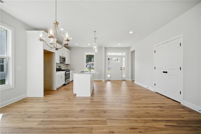 225 Ayrshire Loop, Smithfield, VA 23430 - kitchen featuring stainless steel appliances, a sink, light wood-style floors, recessed lighting, and white cabinetry