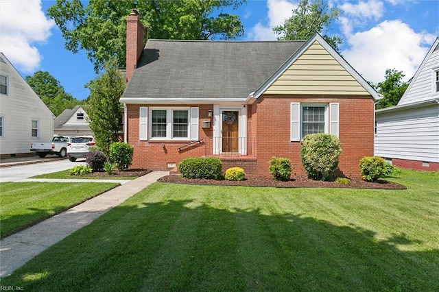 131 Robinson Rd, Hampton, VA 23661 - view of front of home featuring brick siding, a chimney, and a front lawn