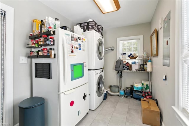 131 Robinson Rd, Hampton, VA 23661 - washroom with stacked washer and clothes dryer and light tile patterned flooring