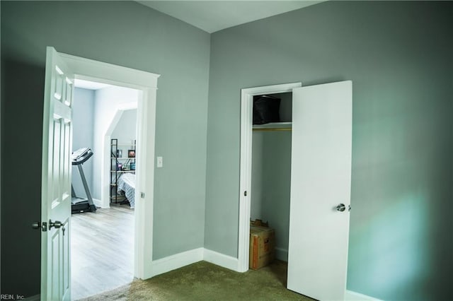 12 Benton Ave, Portsmouth, VA 23702 - unfurnished bedroom featuring baseboards, a closet, and carpet