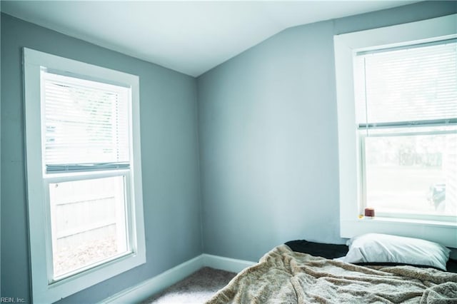12 Benton Ave, Portsmouth, VA 23702 - bedroom with vaulted ceiling, carpet flooring, and baseboards
