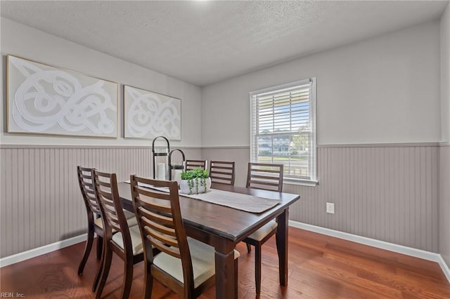 700 Canteberry Ln, Smithfield, VA 23430 - dining room with wood finished floors, baseboards, a wainscoted wall, and a textured ceiling