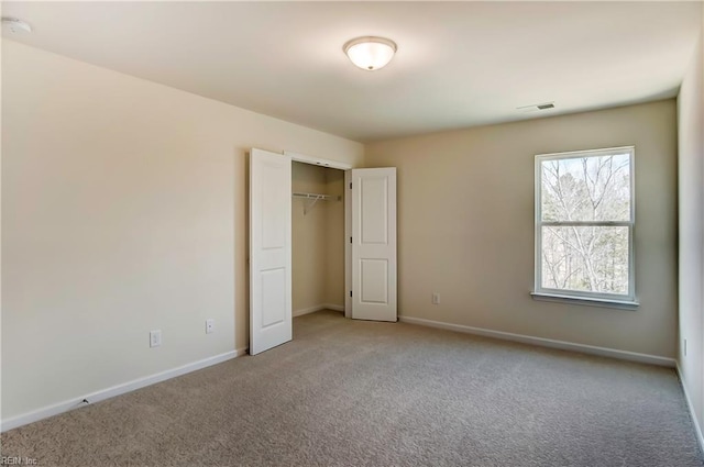 108 Brassy St, Suffolk, VA 23434 - unfurnished bedroom with carpet flooring, baseboards, and a closet