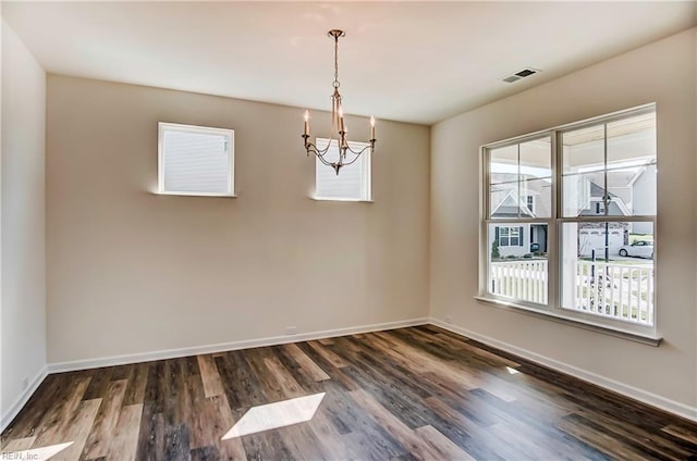 108 Brassy St, Suffolk, VA 23434 - spare room with a chandelier, wood finished floors, and baseboards