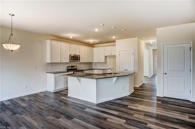 108 Brassy St, Suffolk, VA 23434 - kitchen featuring stainless steel appliances, a sink, dark wood finished floors, white cabinets, and recessed lighting