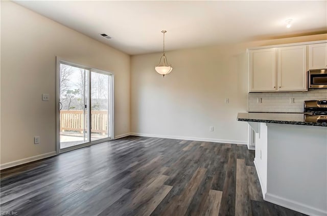 108 Brassy St, Suffolk, VA 23434 - kitchen featuring stainless steel appliances, dark wood finished floors, backsplash, white cabinets, and baseboards
