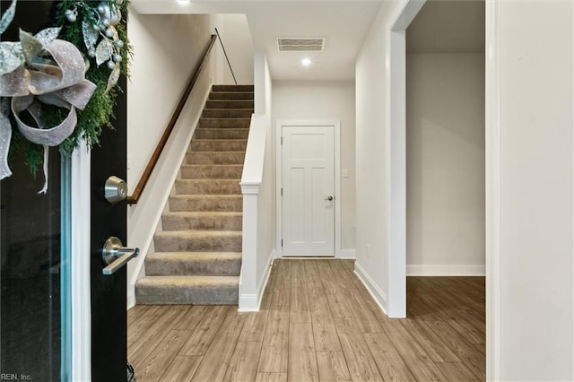 1544 Stanford Ln, Newport News, VA 23608 - entrance foyer featuring light wood finished floors, stairway, baseboards, and recessed lighting