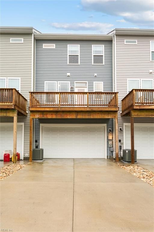 1544 Stanford Ln, Newport News, VA 23608 - back of property with a garage, driveway, and central AC