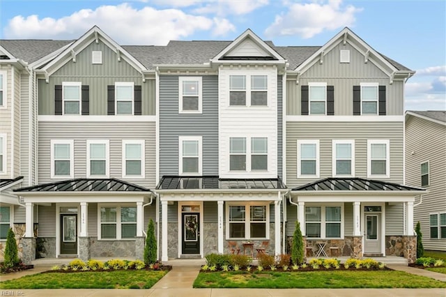 1544 Stanford Ln, Newport News, VA 23608 - multi unit property featuring stone siding, a porch, a standing seam roof, and board and batten siding