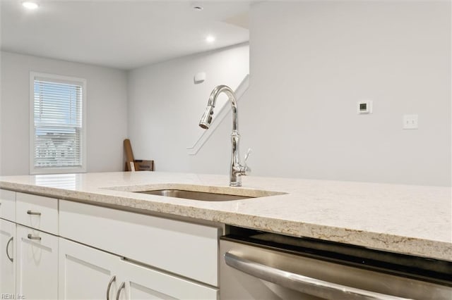 1544 Stanford Ln, Newport News, VA 23608 - kitchen featuring stainless steel dishwasher, a sink, light stone counters, white cabinetry, and recessed lighting