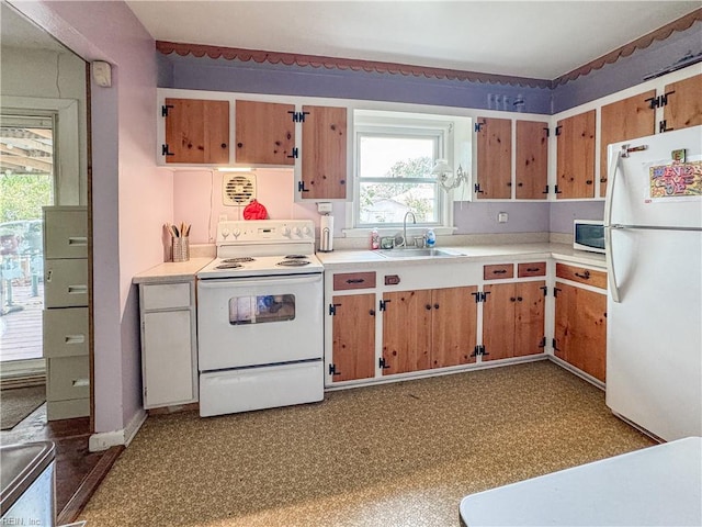1625 Garfield Dr, Norfolk, VA 23503 - kitchen featuring white appliances, a sink, light countertops, and plenty of natural light