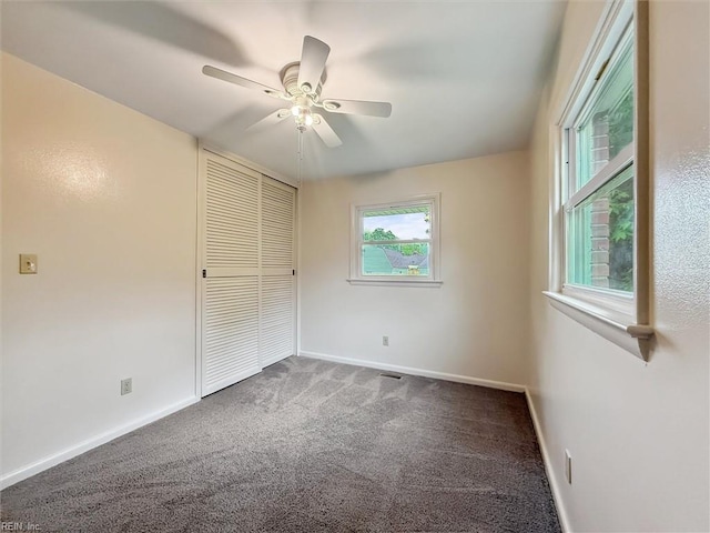 11 Redbud Ln, Newport News, VA 23602 - unfurnished bedroom with carpet flooring, a closet, baseboards, and ceiling fan