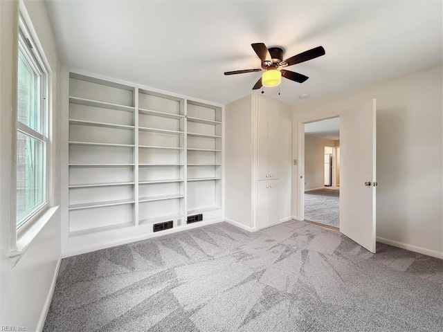 11 Redbud Ln, Newport News, VA 23602 - carpeted spare room featuring baseboards, ceiling fan, and built in features