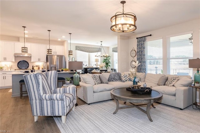 137 Preserve Way, Suffolk, VA 23434 - living room featuring a chandelier, light wood finished floors, and recessed lighting