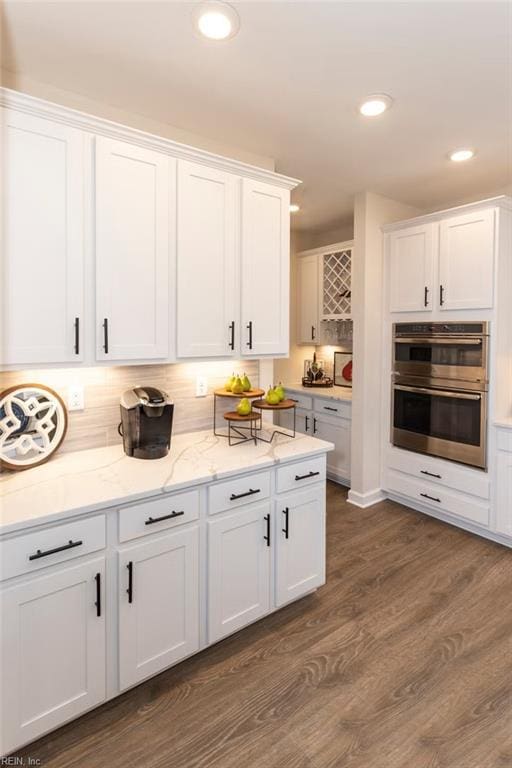137 Preserve Way, Suffolk, VA 23434 - kitchen with double oven, white cabinetry, light stone countertops, dark wood-style flooring, and recessed lighting