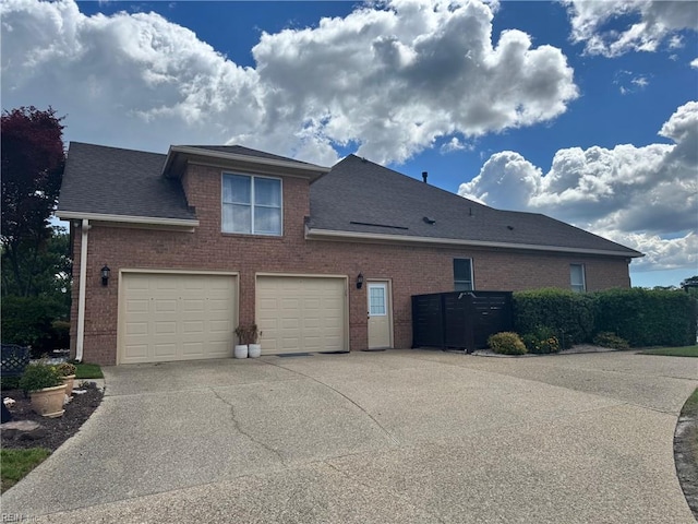 401 Muirfield, Smithfield, VA 23430 - view of side of property with driveway, brick siding, an attached garage, and roof with shingles