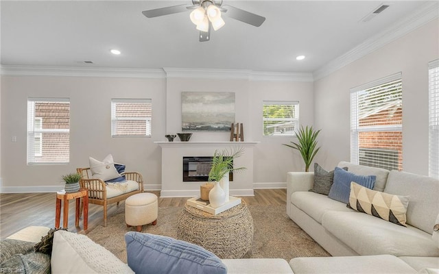 1608 Holland Ave, Norfolk, VA 23509 - living area featuring light wood finished floors, baseboards, crown molding, a ceiling fan, and recessed lighting
