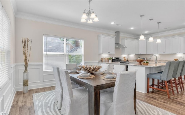 1608 Holland Ave, Norfolk, VA 23509 - dining room with light wood-style floors, wainscoting, a chandelier, ornamental molding, and recessed lighting