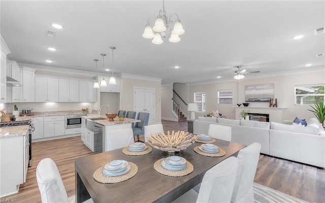 1608 Holland Ave, Norfolk, VA 23509 - dining area with ornamental molding, a ceiling fan, stairs, light wood-style flooring, and recessed lighting