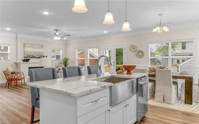 1608 Holland Ave, Norfolk, VA 23509 - kitchen with crown molding, a sink, light wood finished floors, dishwasher, and a kitchen bar