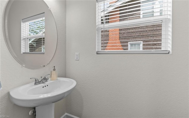 1608 Holland Ave, Norfolk, VA 23509 - bathroom featuring a textured wall and a sink