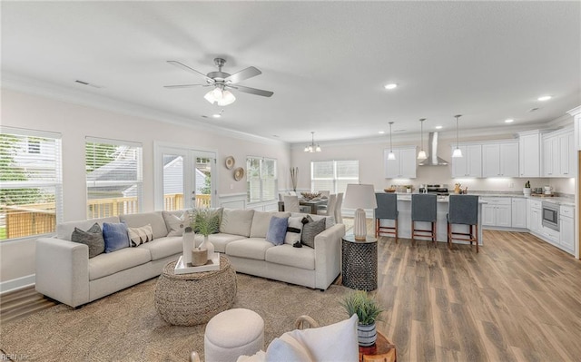 1608 Holland Ave, Norfolk, VA 23509 - living area with light wood finished floors, crown molding, ceiling fan, and recessed lighting