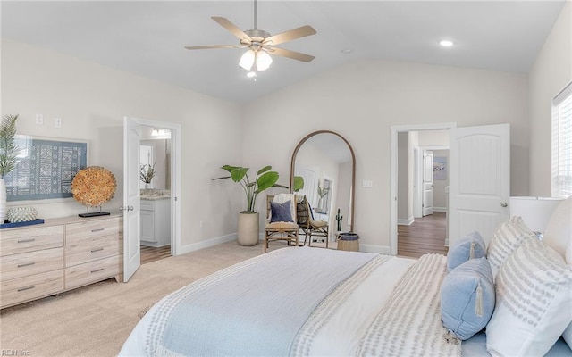1608 Holland Ave, Norfolk, VA 23509 - bedroom featuring vaulted ceiling, baseboards, connected bathroom, ceiling fan, and light carpet