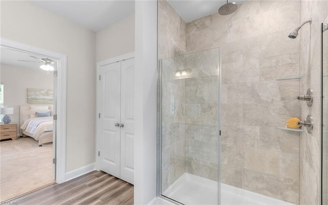 1608 Holland Ave, Norfolk, VA 23509 - ensuite bathroom featuring a stall shower, wood finished floors, baseboards, and a ceiling fan