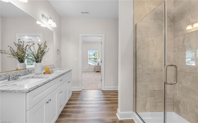1608 Holland Ave, Norfolk, VA 23509 - full bathroom with vanity, wood finished floors, a shower stall, and baseboards