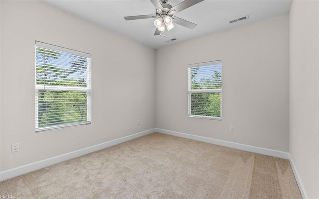 1608 Holland Ave, Norfolk, VA 23509 - spare room featuring light carpet, baseboards, and a ceiling fan