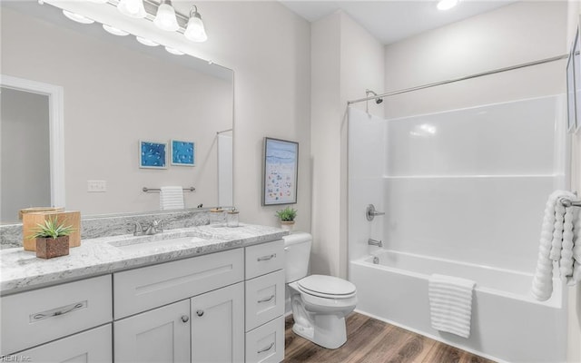 1608 Holland Ave, Norfolk, VA 23509 - bathroom featuring wood finished floors, toilet, vanity, and shower / tub combination
