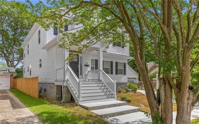 1608 Holland Ave, Norfolk, VA 23509 - view of front facade with a garage, driveway, and covered porch