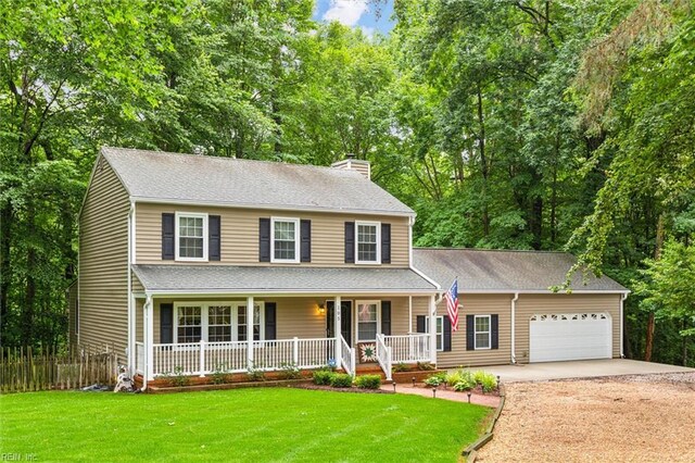 105 Stavenger Ct, Williamsburg, VA 23188 - view of front of property featuring an attached garage, a chimney, covered porch, concrete driveway, and a front lawn