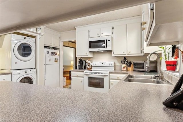 105 Stavenger Ct, Williamsburg, VA 23188 - kitchen with white appliances, stacked washer / dryer, a sink, and white cabinets