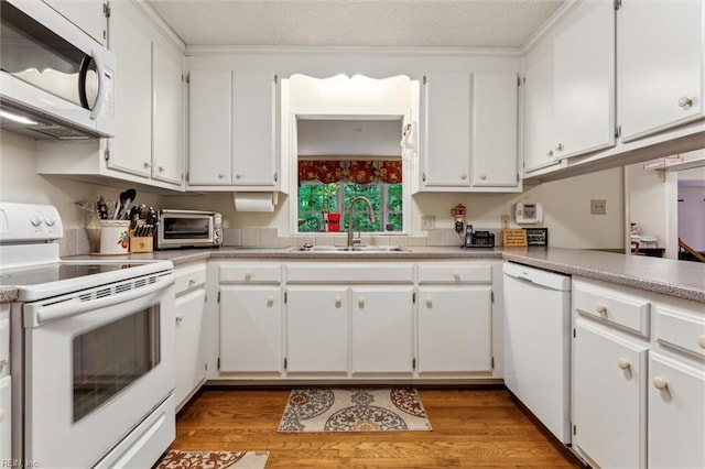 105 Stavenger Ct, Williamsburg, VA 23188 - kitchen featuring white appliances, a sink, light wood finished floors, white cabinets, and a textured ceiling