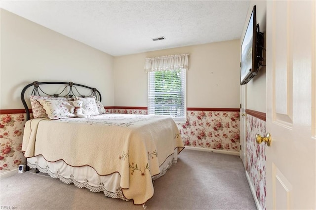 105 Stavenger Ct, Williamsburg, VA 23188 - bedroom featuring wallpapered walls, carpet floors, baseboards, and a textured ceiling