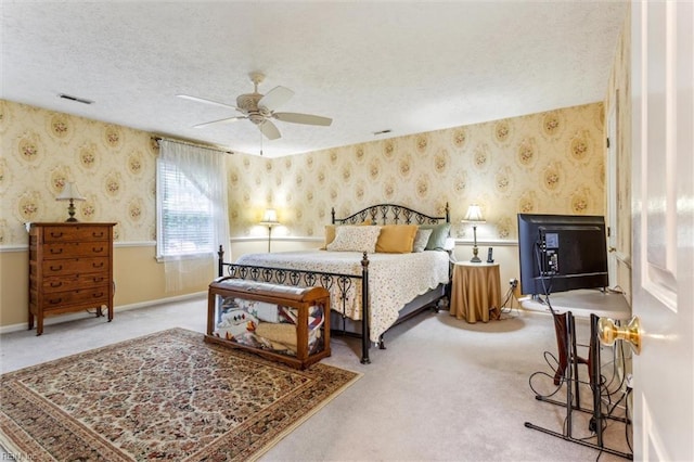 105 Stavenger Ct, Williamsburg, VA 23188 - bedroom featuring wallpapered walls, a textured ceiling, carpet, a ceiling fan, and baseboards
