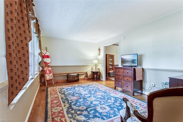 105 Stavenger Ct, Williamsburg, VA 23188 - sitting room with wood finished floors and a textured ceiling